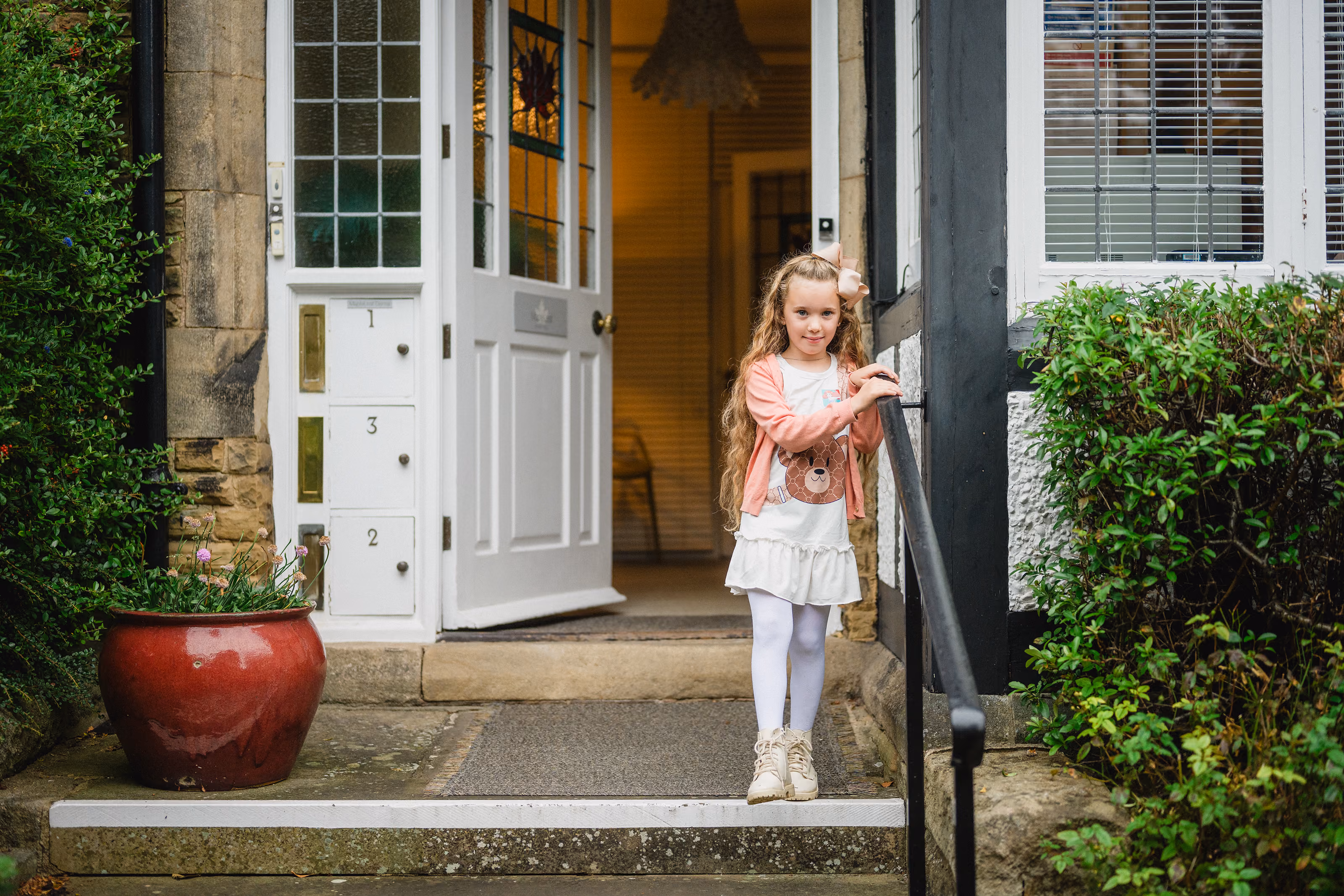 Small girl patient outside our dental practice