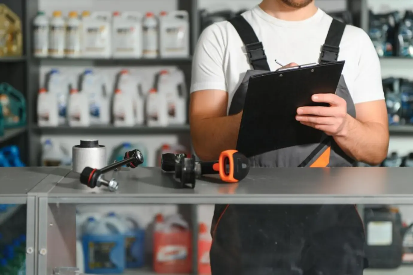 Person struggling to find the correct spare part from printed catalogs