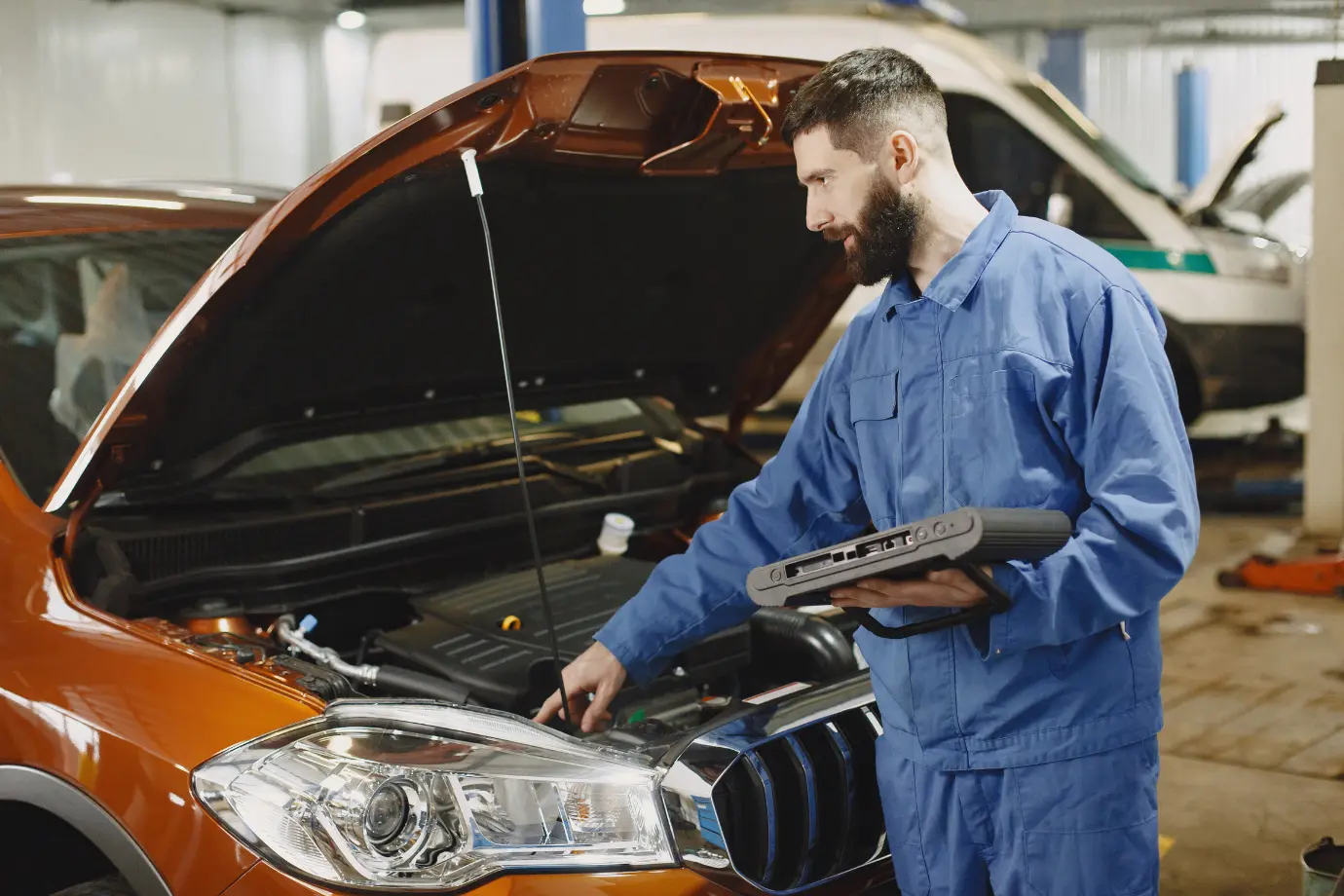Service advisor demonstrating how Intelli Estimate calculates accurate repair estimates in an auto shop setting