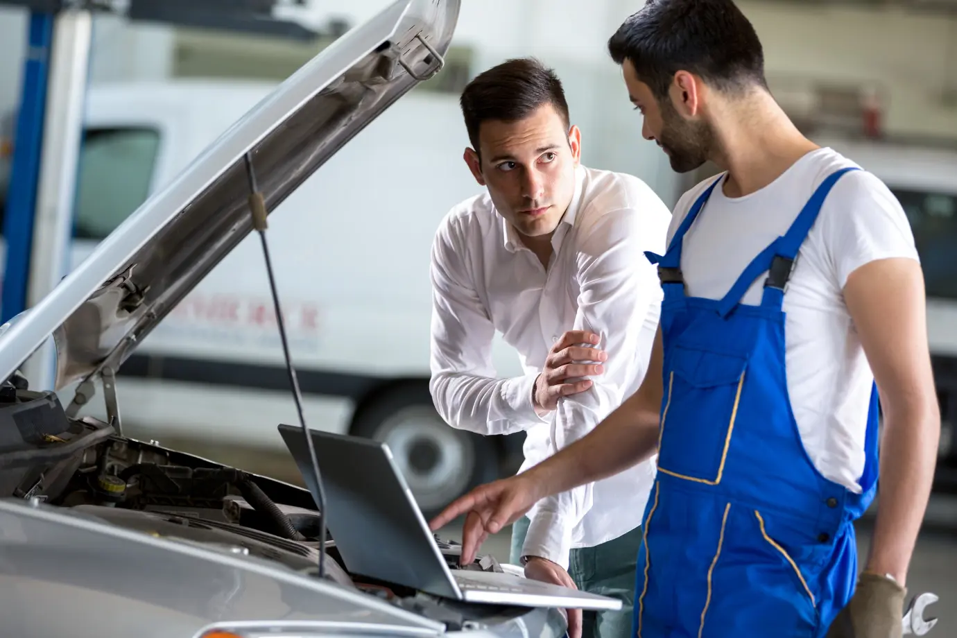 Technician using Intelli Estimate integrated with a parts catalog software to create a job card for a repair