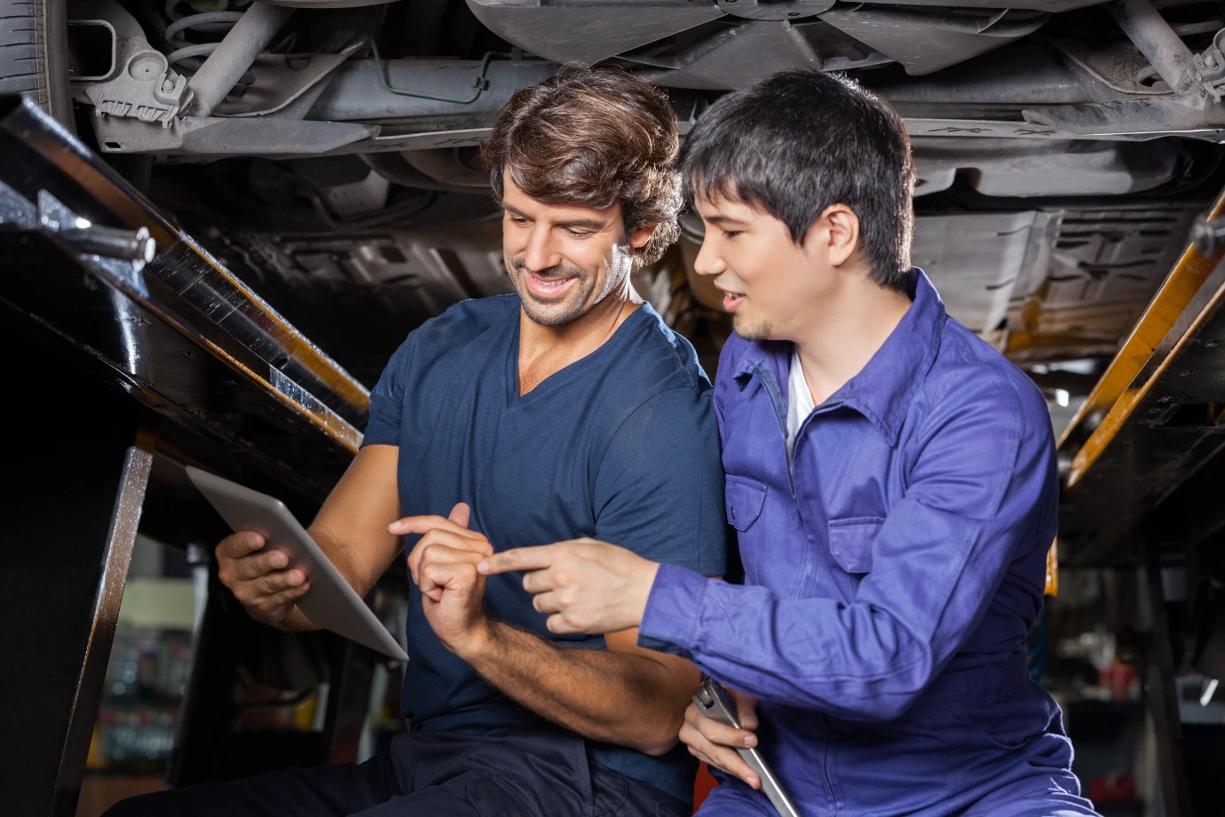 Field engineers accessing an AI-powered service manual on a device for accurate troubleshooting