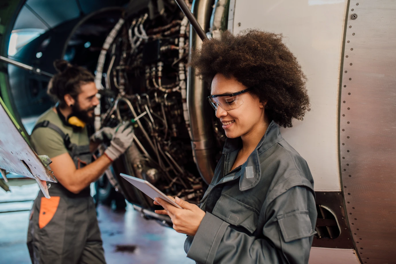 Team of technicians collaborating to implement AI-powered service manuals