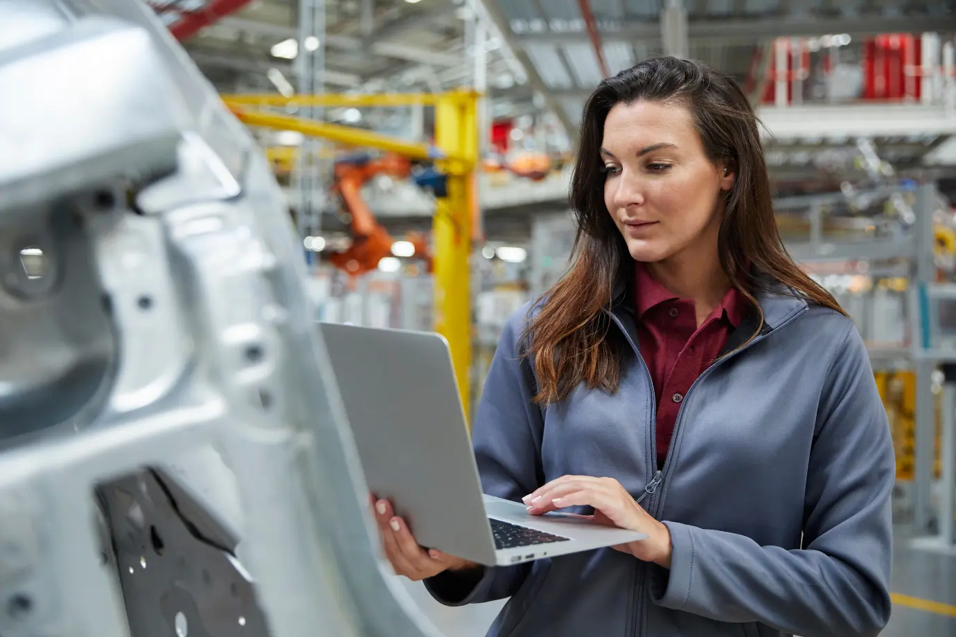 OEM engineer analyzing software-defined vehicle systems, balancing risks and growth chances