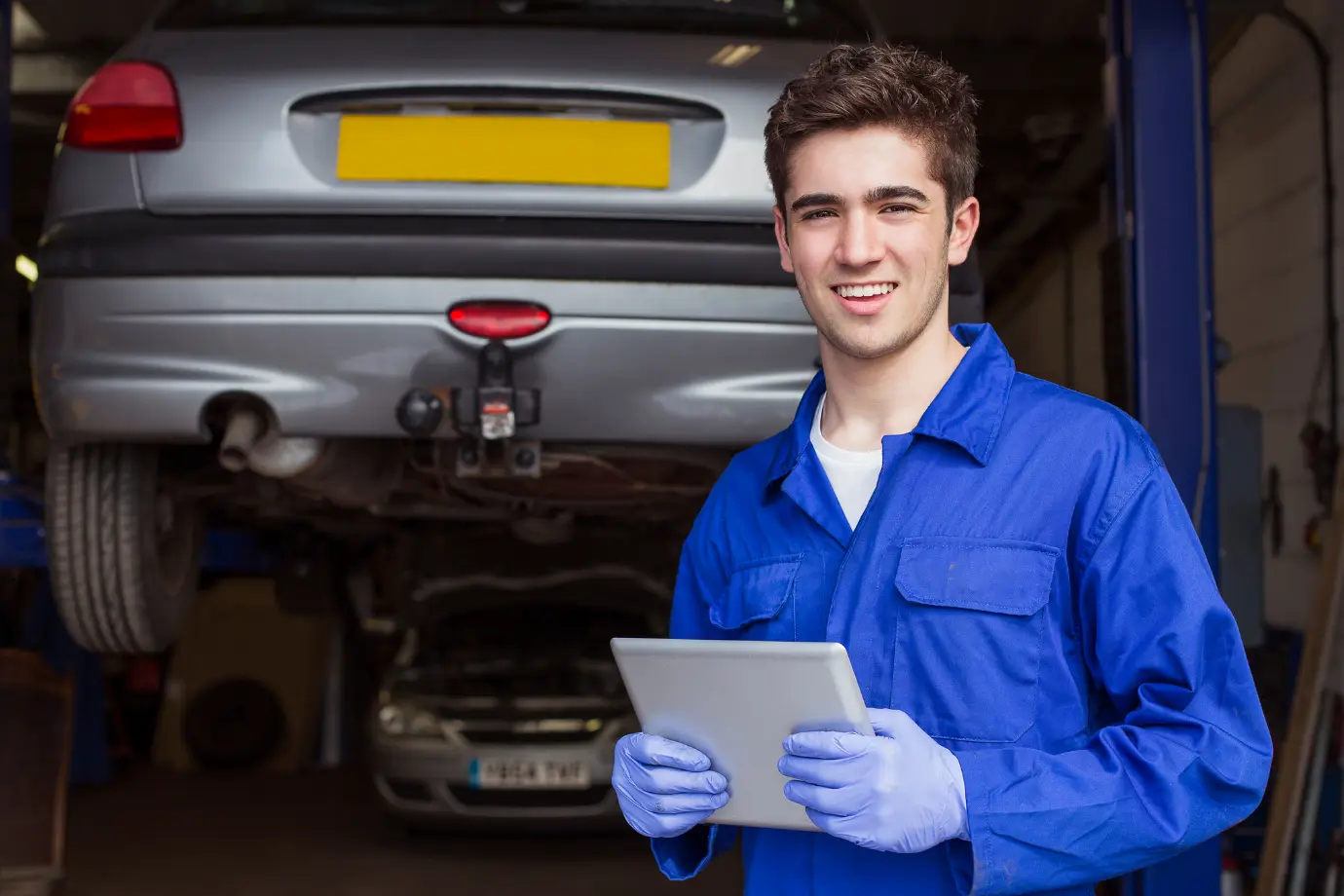 Mechanic benefiting from a fast, organized digital spare parts catalog during repairs
