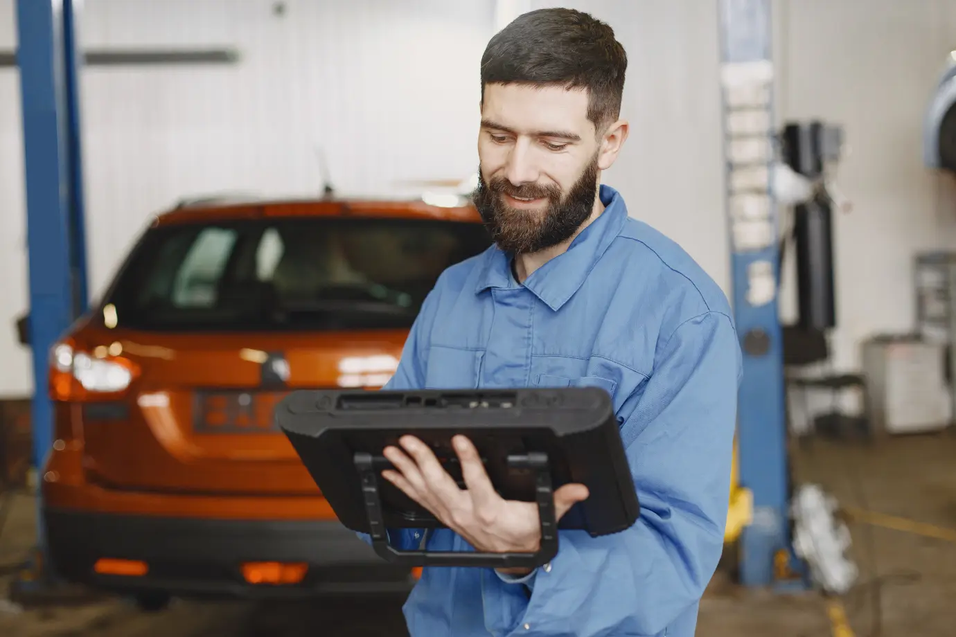 Technician using AI-powered search for faster diagnostics and repair