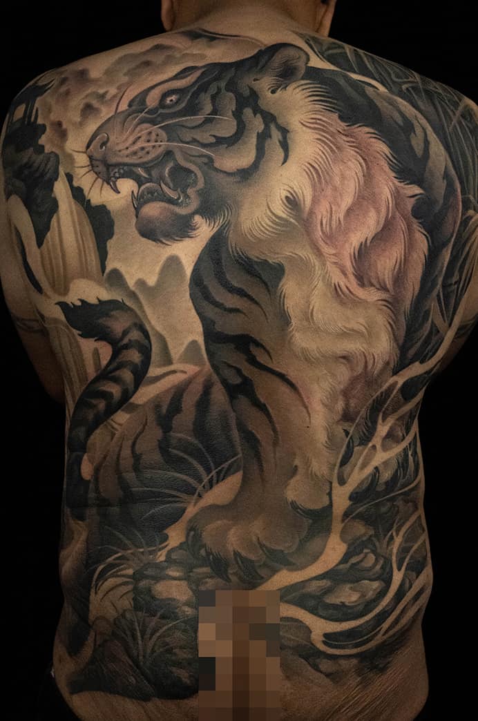 Realistic tiger back tattoo in black and grey detailed artwork