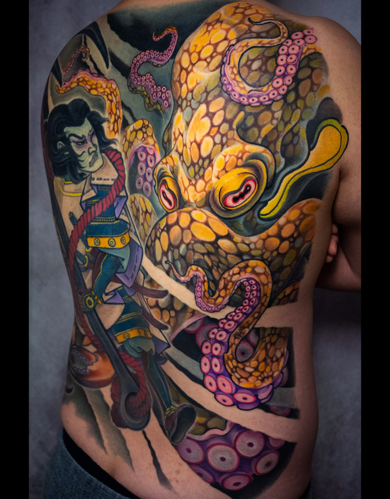 Colorful octopus back tattoo in Japanese style marine artwork