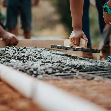 Close up view of concrete being pouring on site.