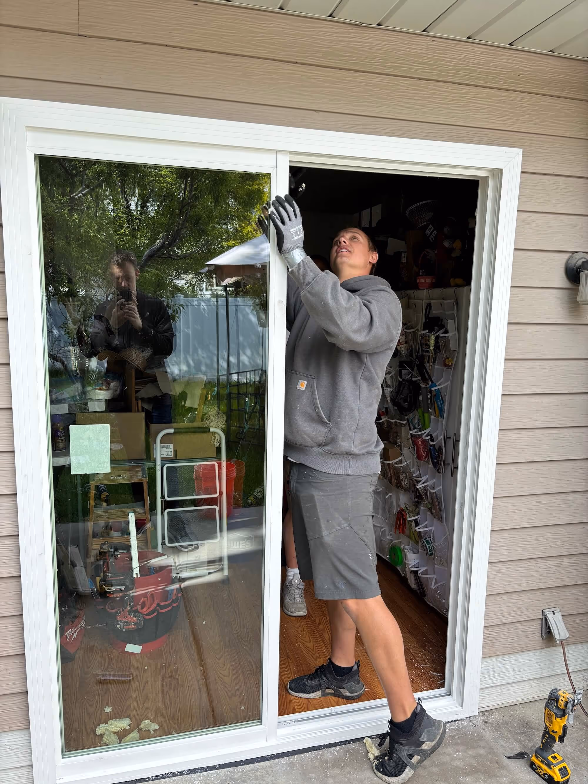 Sliding glass door being installed 