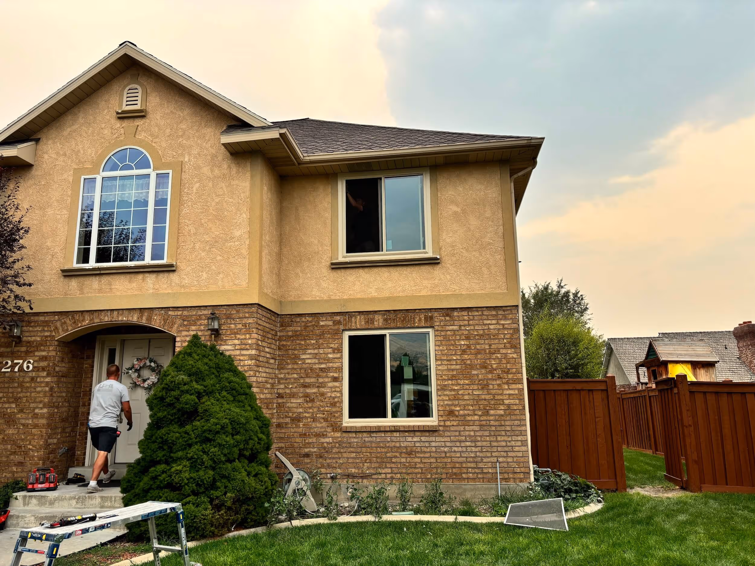 Utah home exterior in the summer time who's windows have been replaced.