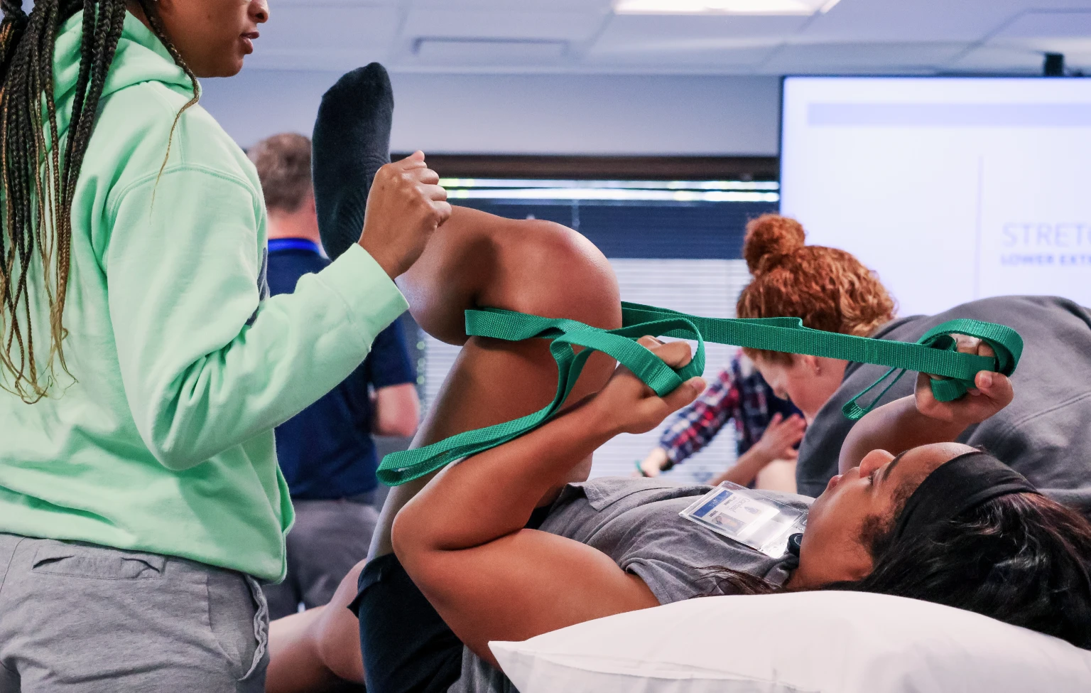 Doctor of Physical Therapy students at Graceland University practice lower extremity stretching techniques during a hands-on lab immersion.
