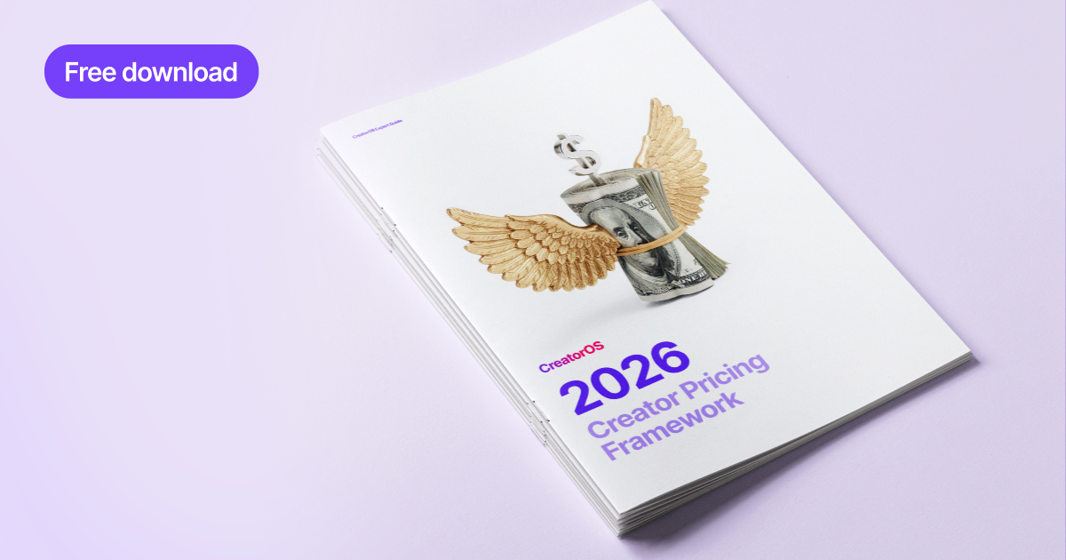 Creator holding contract in front of her face