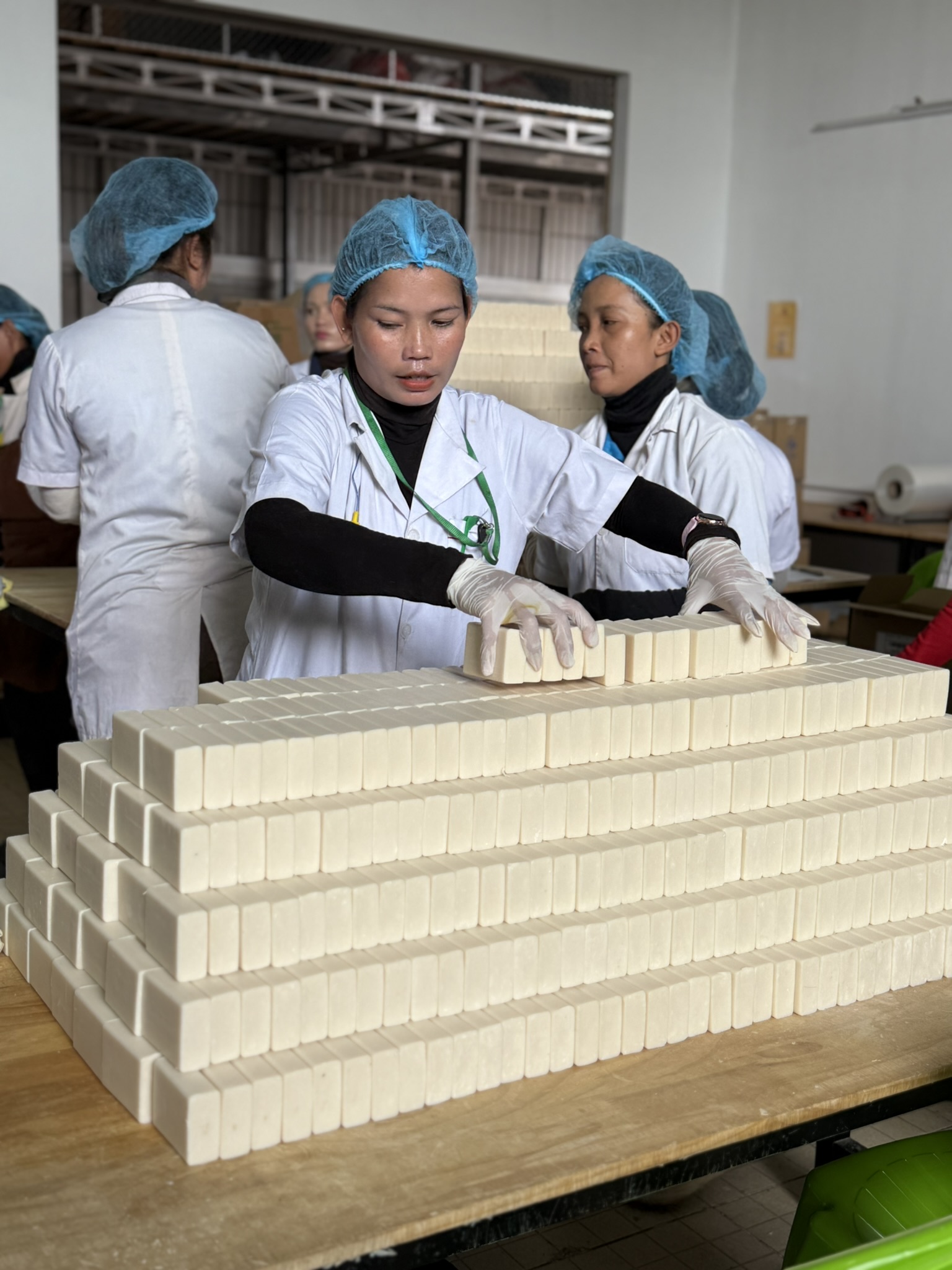 An EcoSoap soapmaker at work in one of our hubs