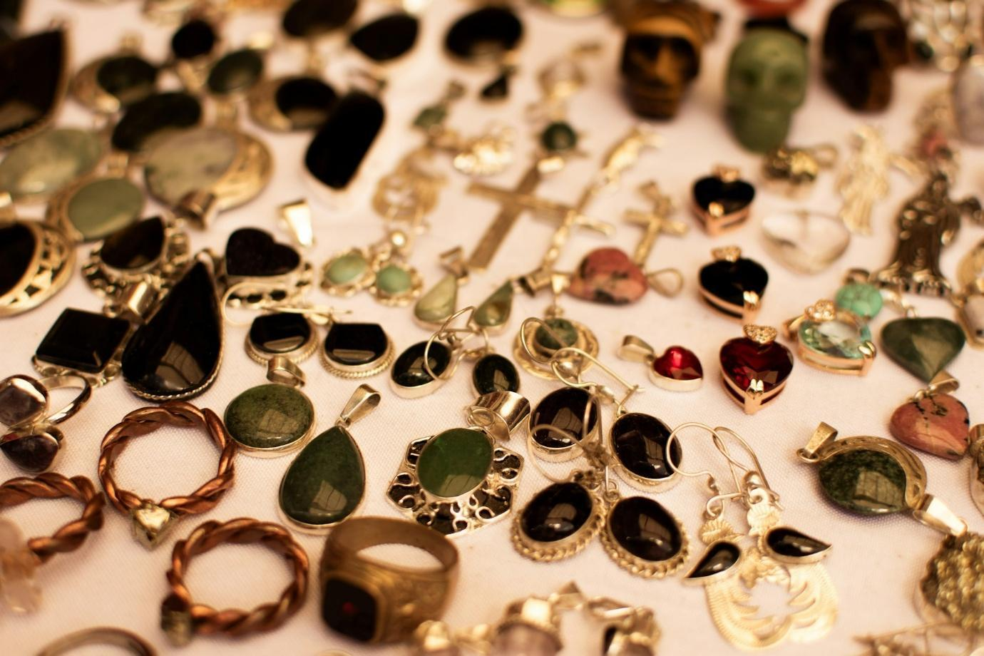 A collection of jewelry on a tableAI-generated content may be incorrect.
