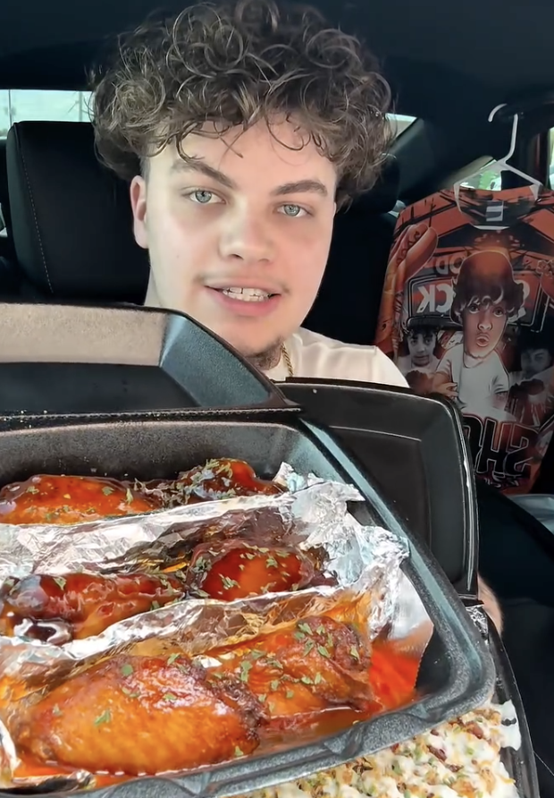customer with takeout from Valley Wings Dallas