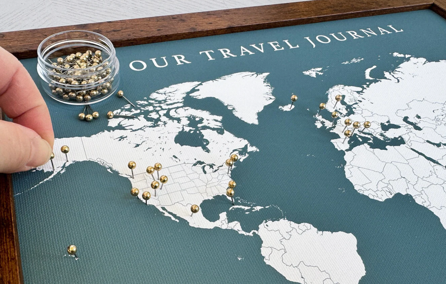 push pin map to mark the new couple's travels together