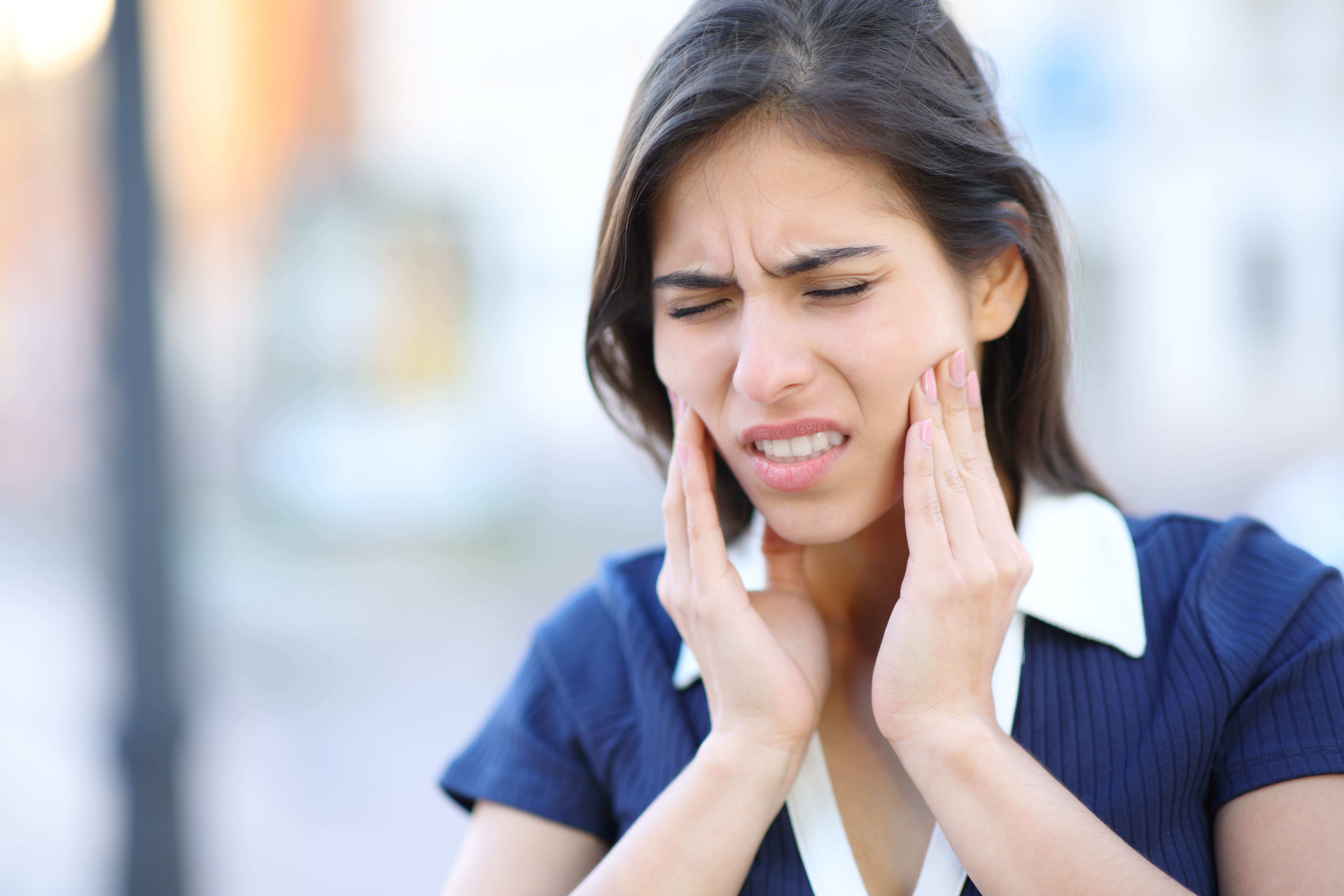 Patient experiencing jaw pain due to stress-related TMD – This Is It Dental, Harley Street London