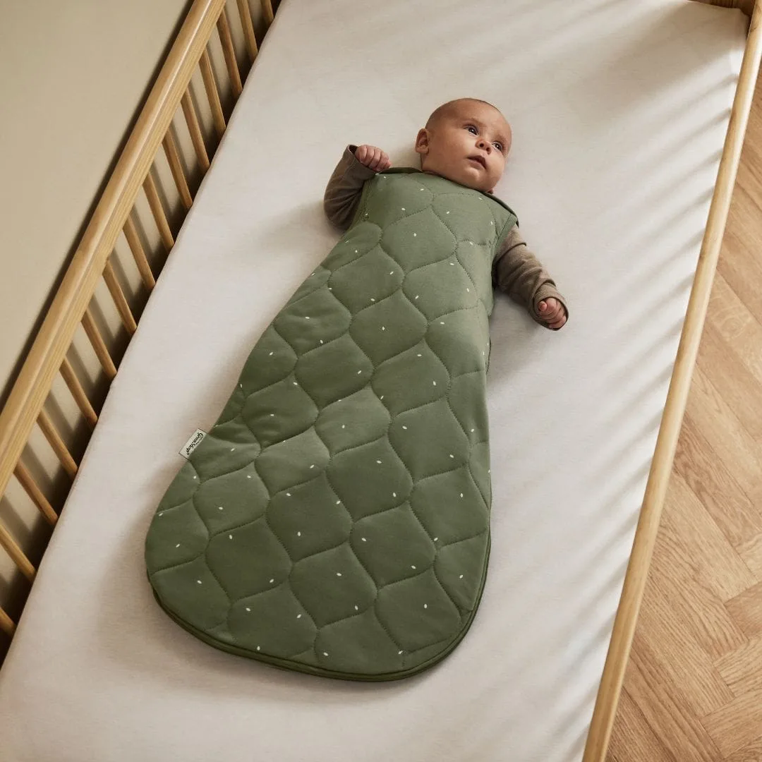 The Little Green Sheep organic quilted baby sleeping bag in juniper green with a sage rice print