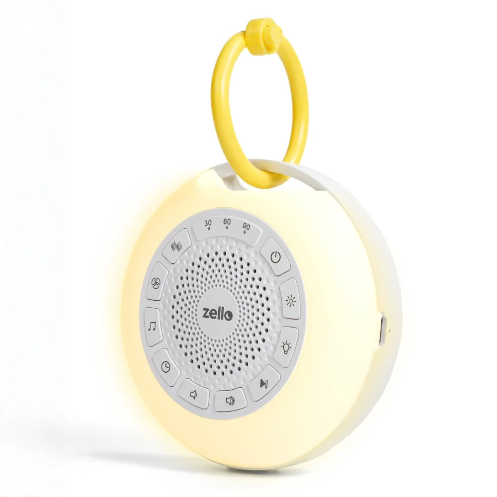 The Zello Portable Pro Max white noise machine and night light with its yellow clip ring