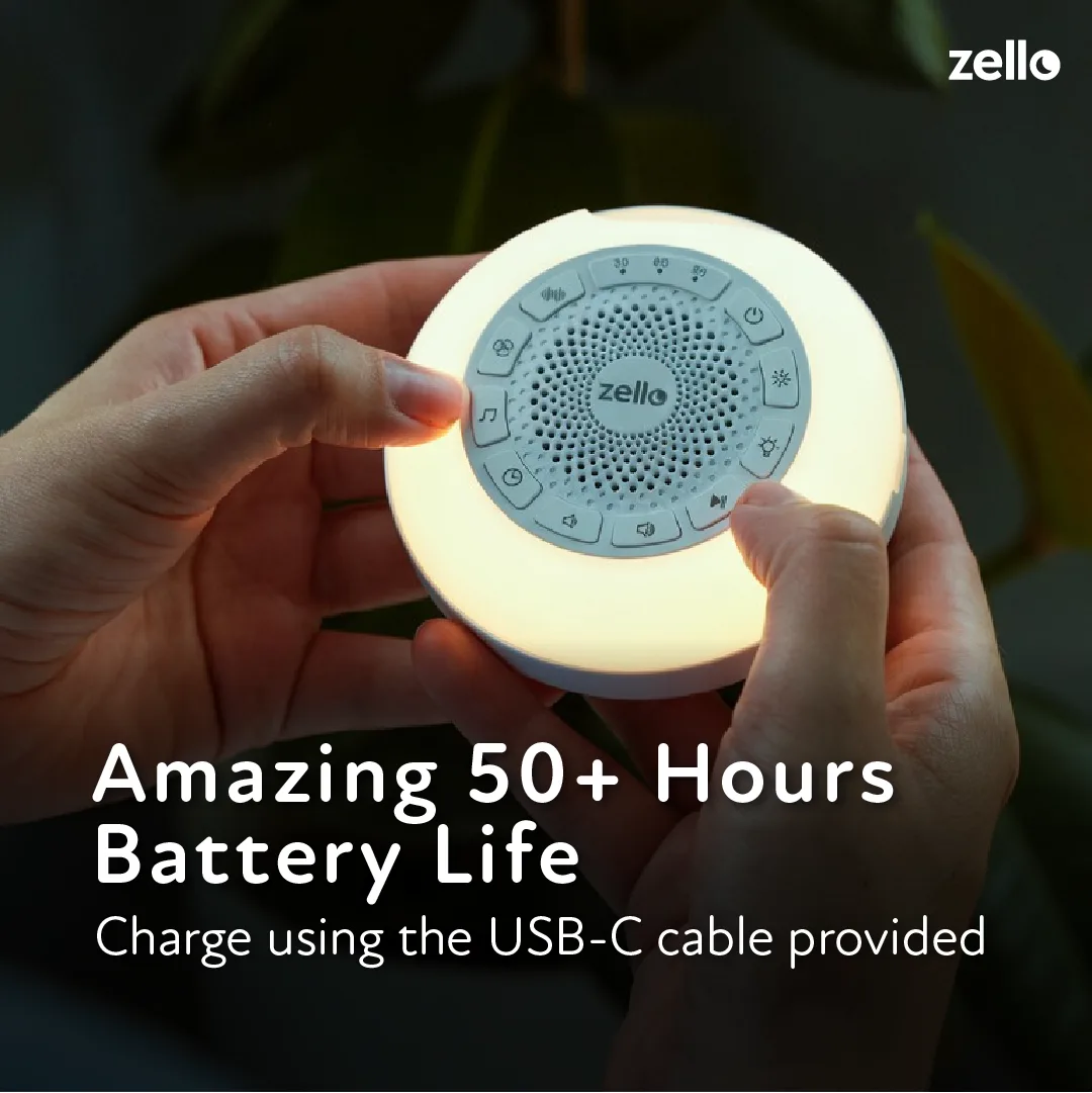 Hands holding the Zello Portable Pro Max with its warm night light glowing