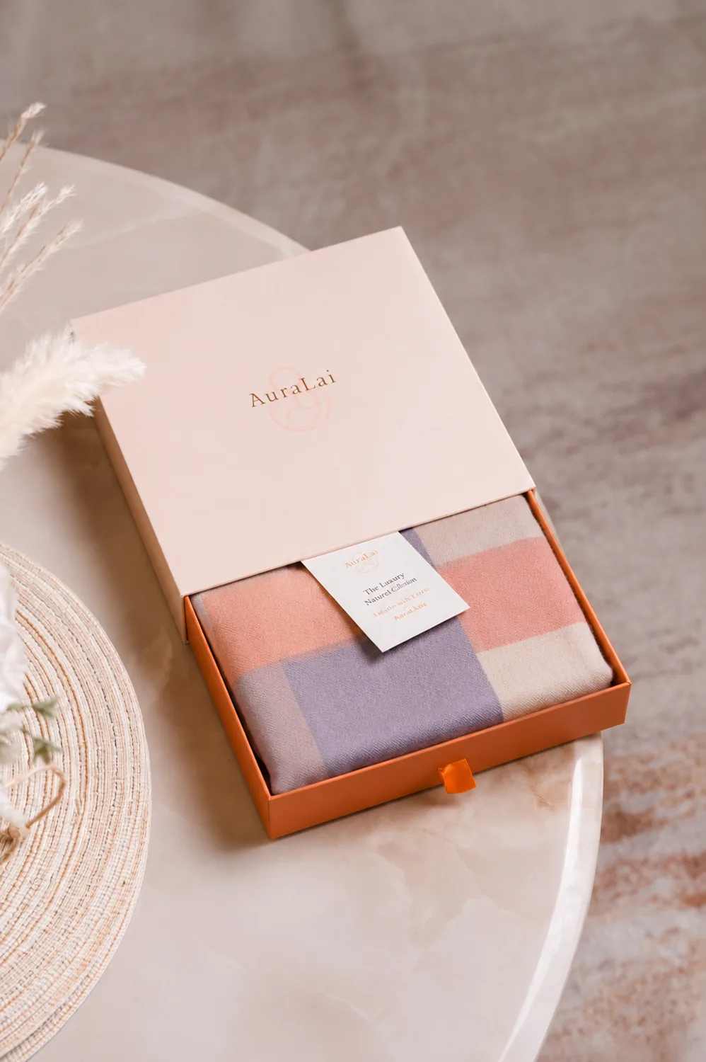 An AuraLai nursing cover presented in its gift box