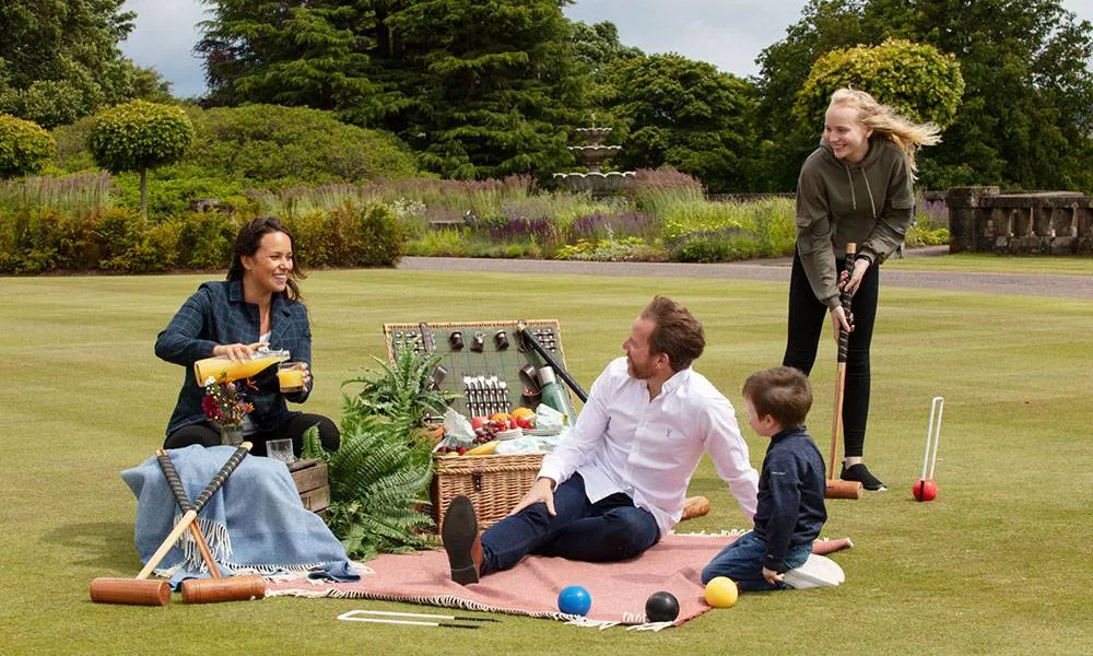 A family picnic and croquet on the lawn at Gleneagles