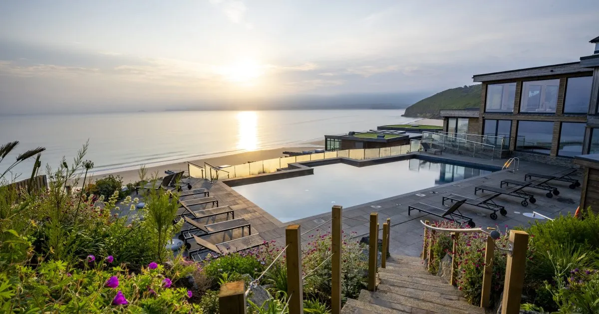Carbis Bay Hotel's terraces and pool overlooking the bay at sunset