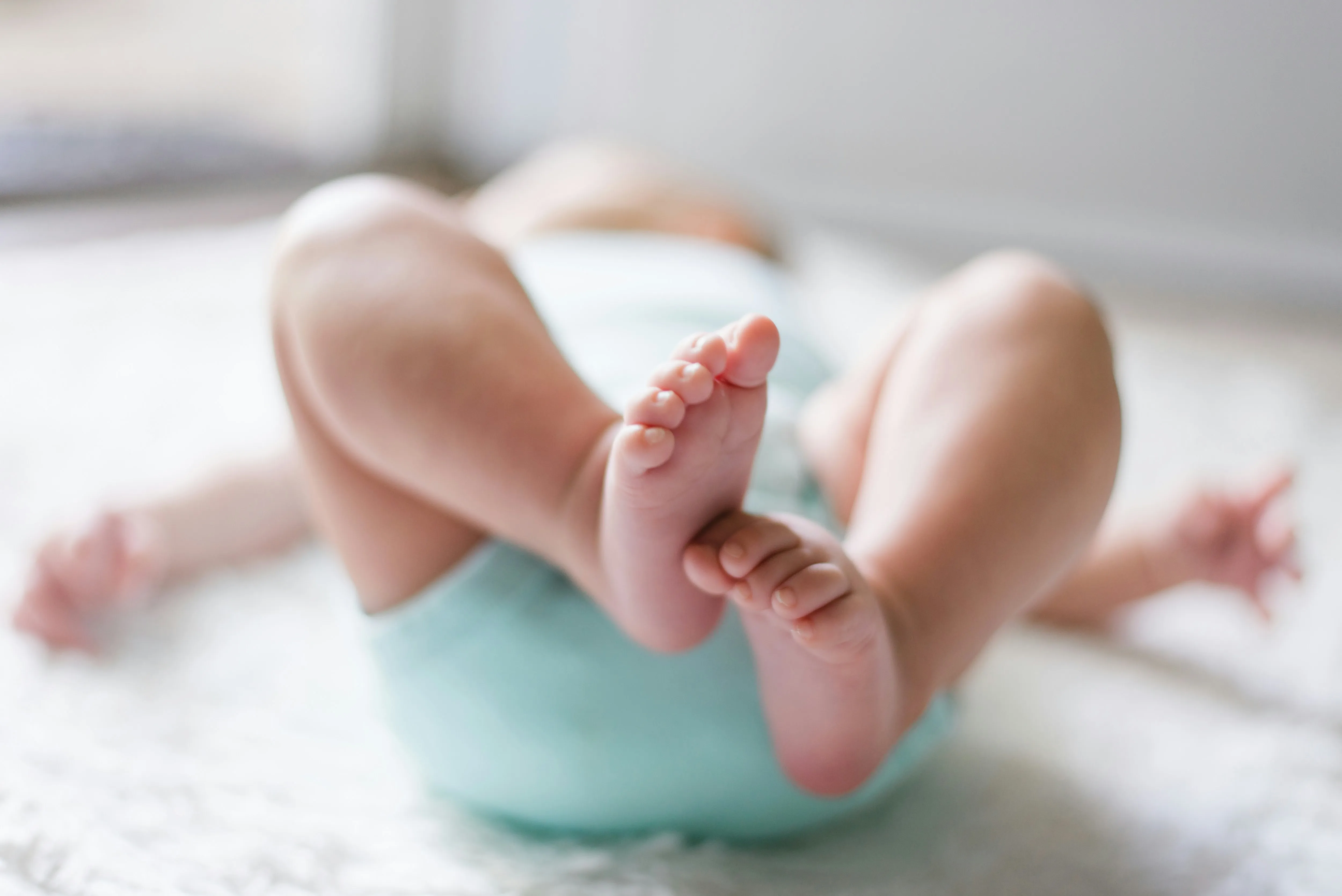 Baby's tiny feet are a work of art!