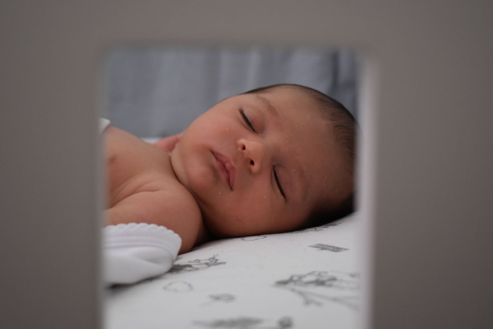 Baby sleeping peacefully on their back