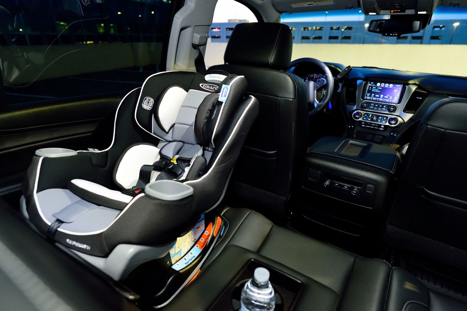 Child car seat fitted in the back of a car