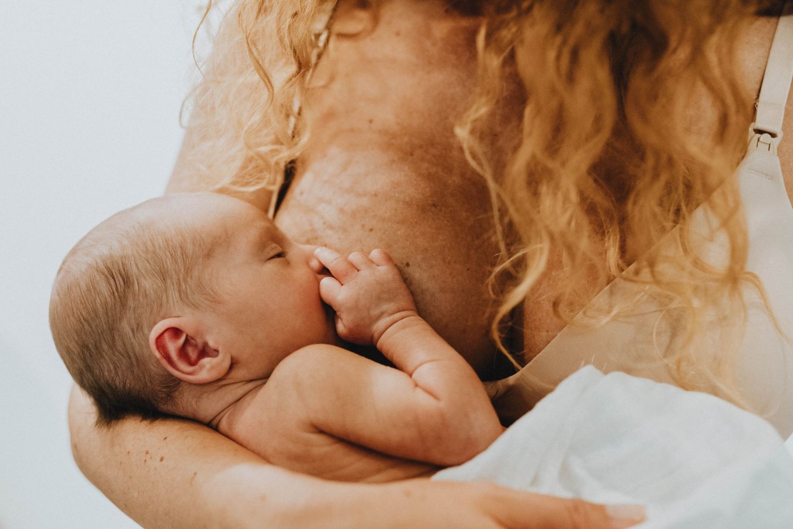 Mum breastfeeding her newborn baby