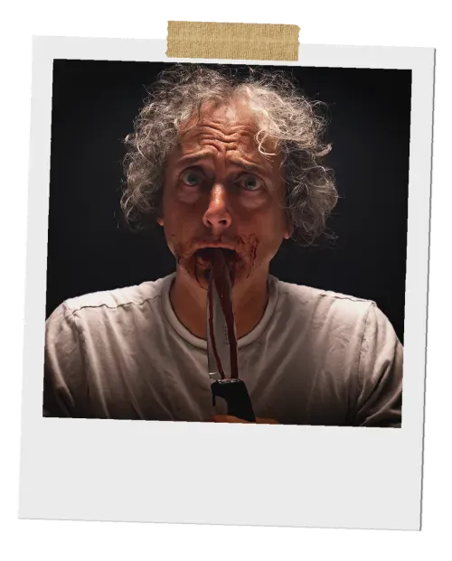 A close-up Polaroid photo of a man with wild hair and wide eyes, leaning forward with a menacing look on his face, his mouth smeared with fake blood.