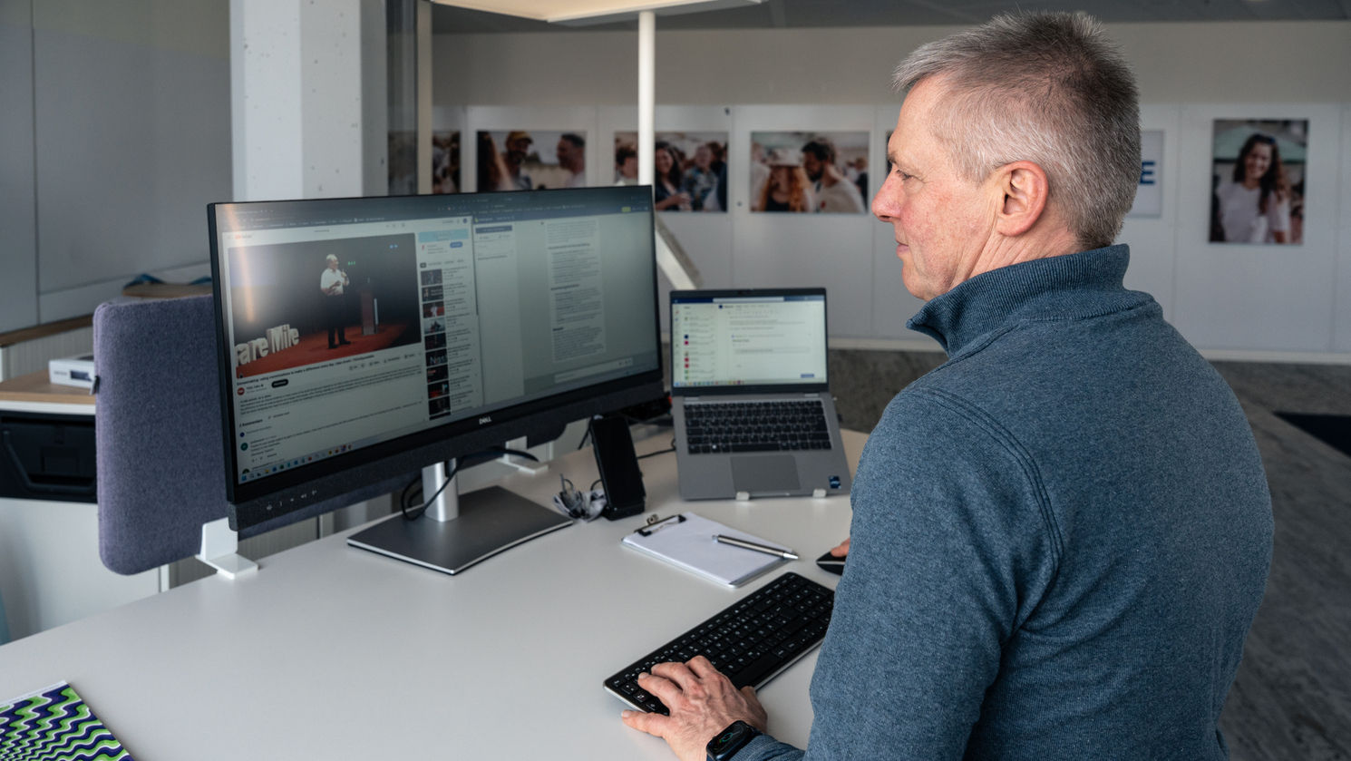 Tobias, Marketing Manager at Haufe Group, at his desk watching a TED Talk – working on his Future Skill Sensemaking as part of the learning program.