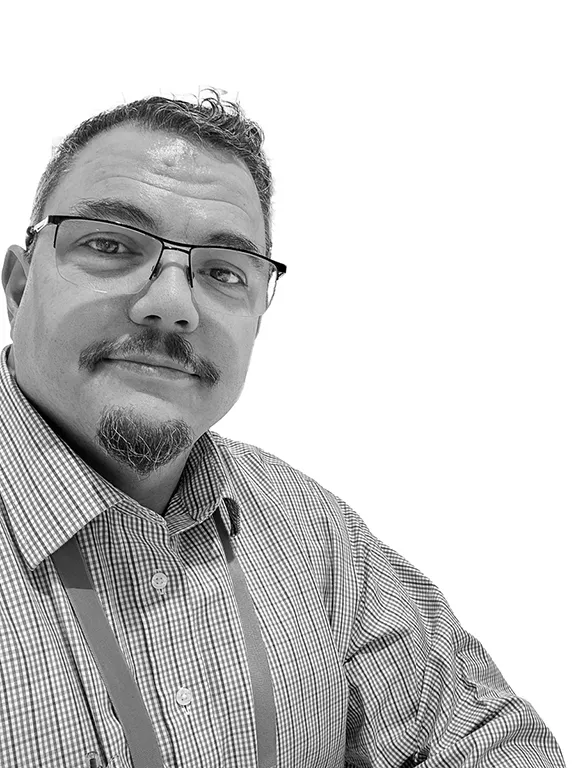 A casual black and white chest up shot of Ben Finklea.