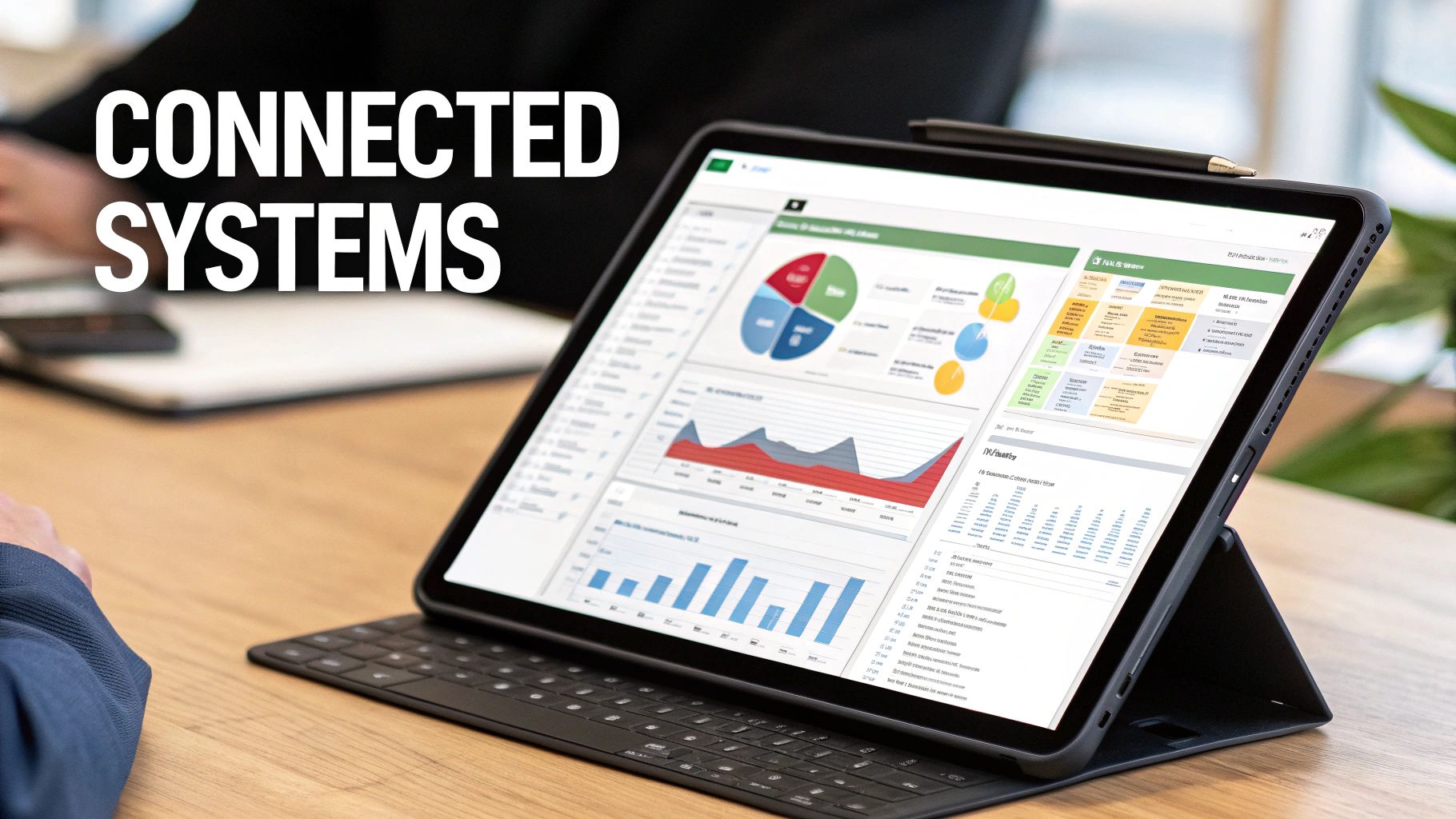 A tablet displaying a data dashboard with charts and graphs, emphasizing connected business systems.