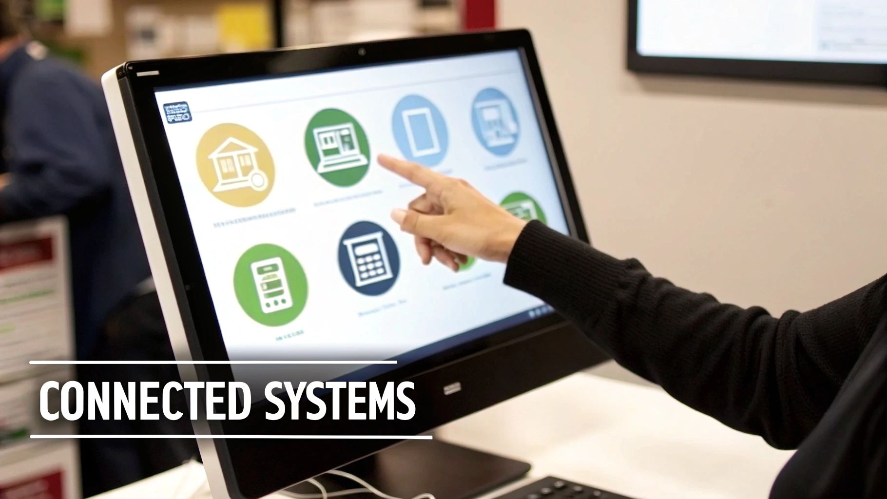 A hand touches a touchscreen computer displaying various business and financial service icons.