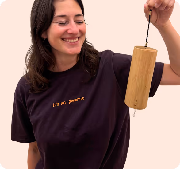 woman wearing heyyoli it’s my pleasure tshirt in plum with orange embroidery and kushi 