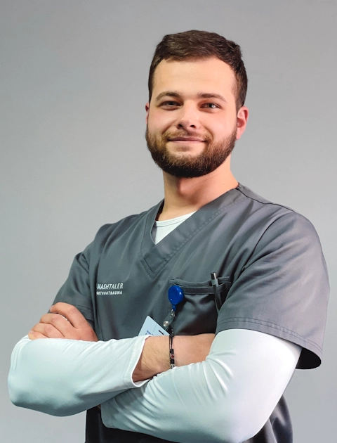 The photo shows Ivan Romanchyshyn — physical therapist, occupational therapist of Mashtaler Ortho&Trauma Medical Center
