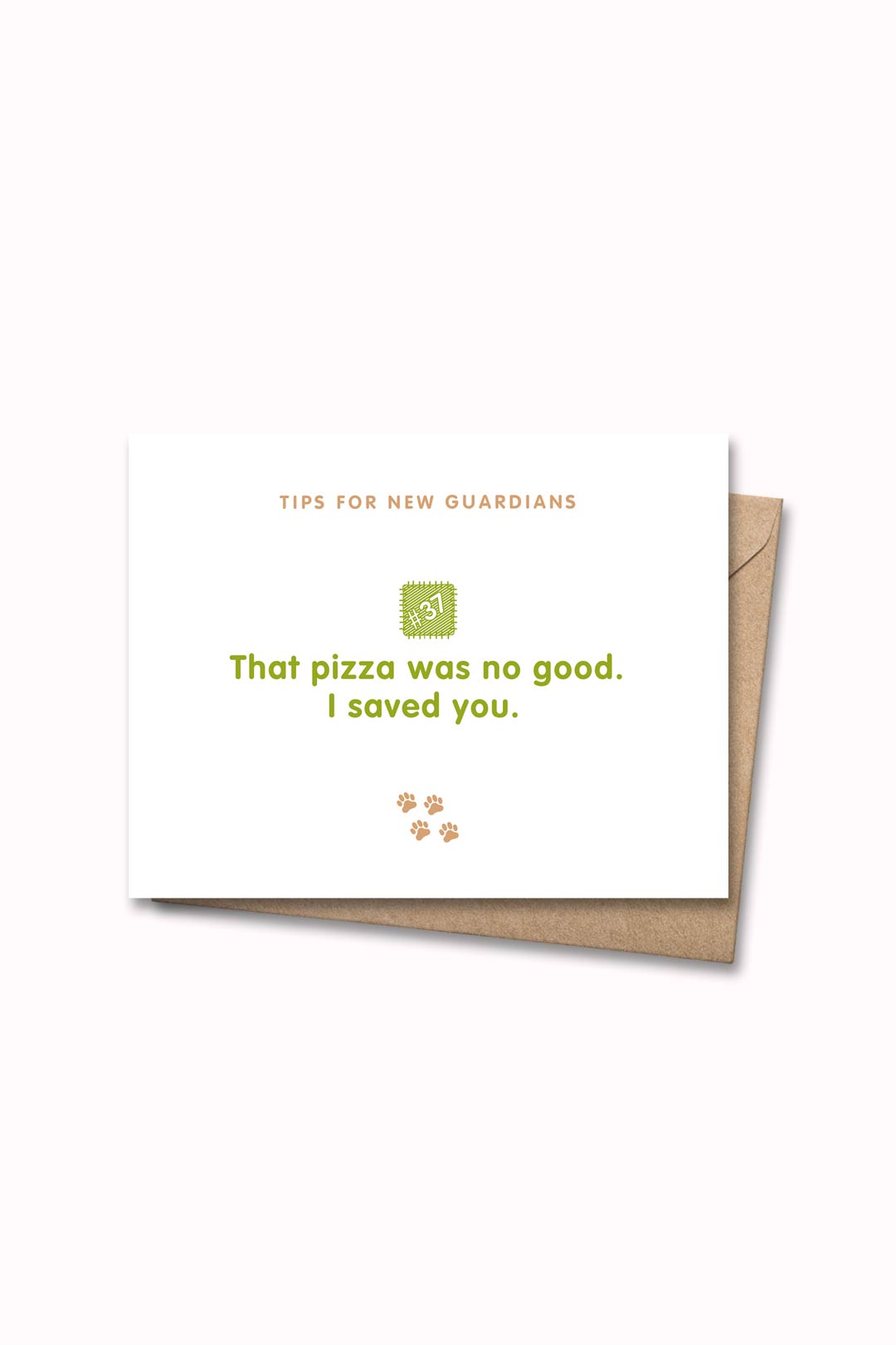 Letterpressed greeting card with wooden block and paw prints illustrations, the words "tips for new guardians: that pizza was no good. I saved you." on white background, and taupe envelope
