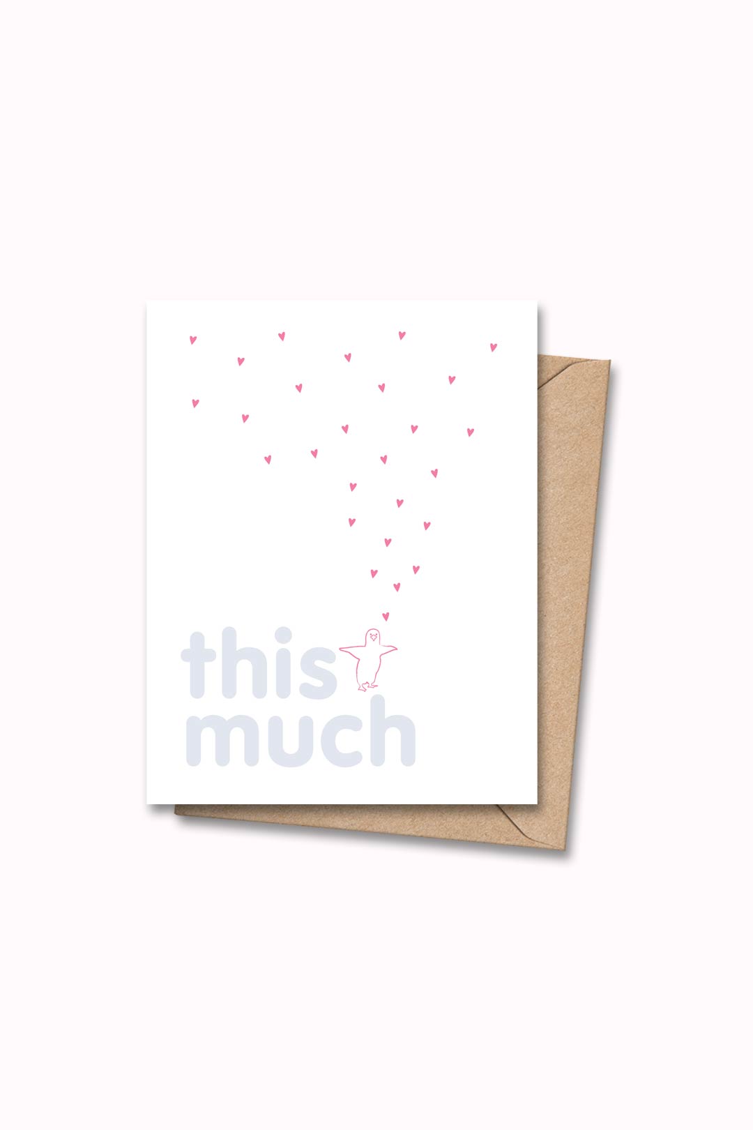 Letterpressed greeting card with pink penguin and hearts next to blue letters "this much" on white card and taupe envelope