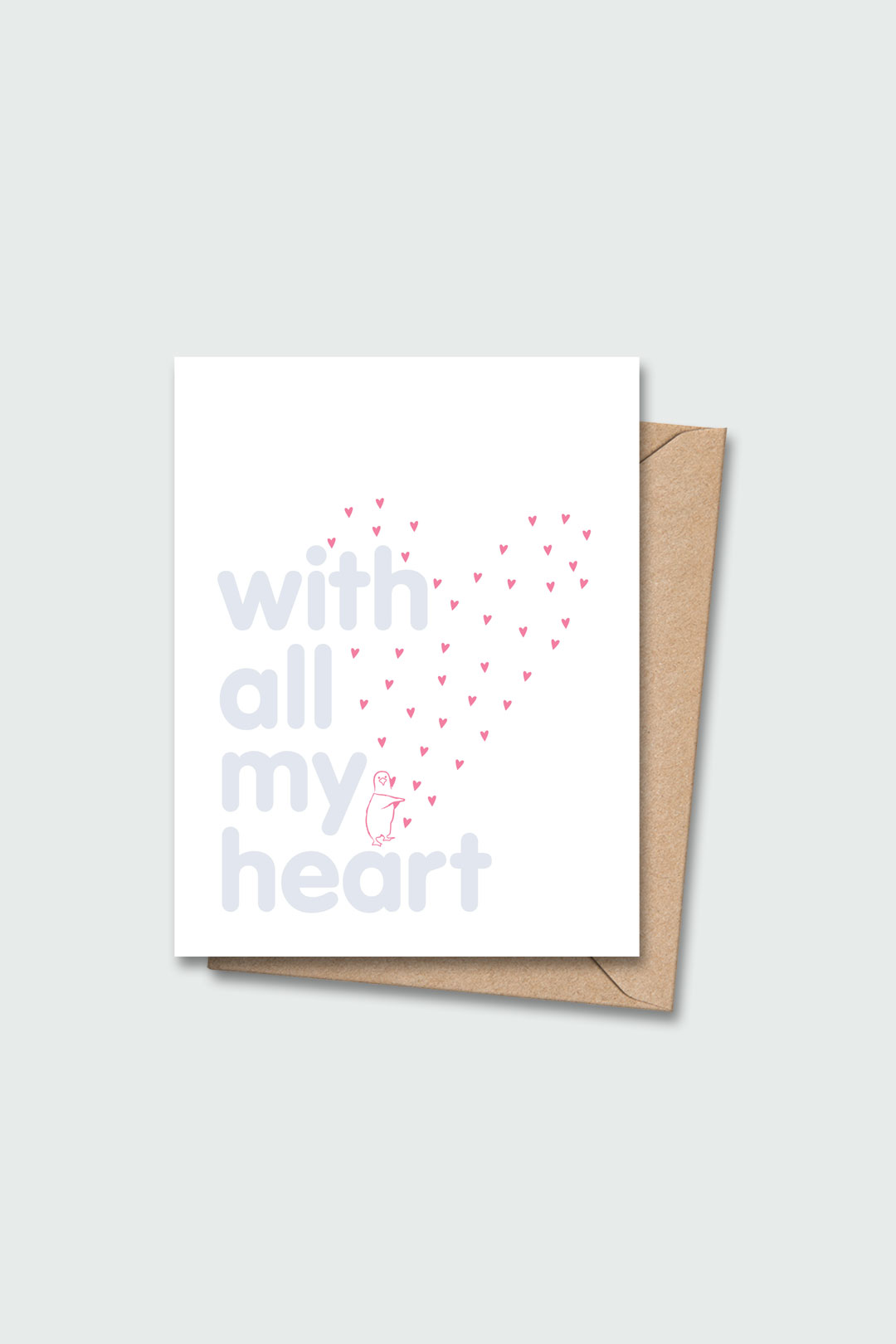 Letterpressed greeting card with pink penguin and hearts next to blue letters "with all my heart" on white card and taupe envelope