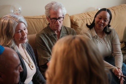 A group of people together talking