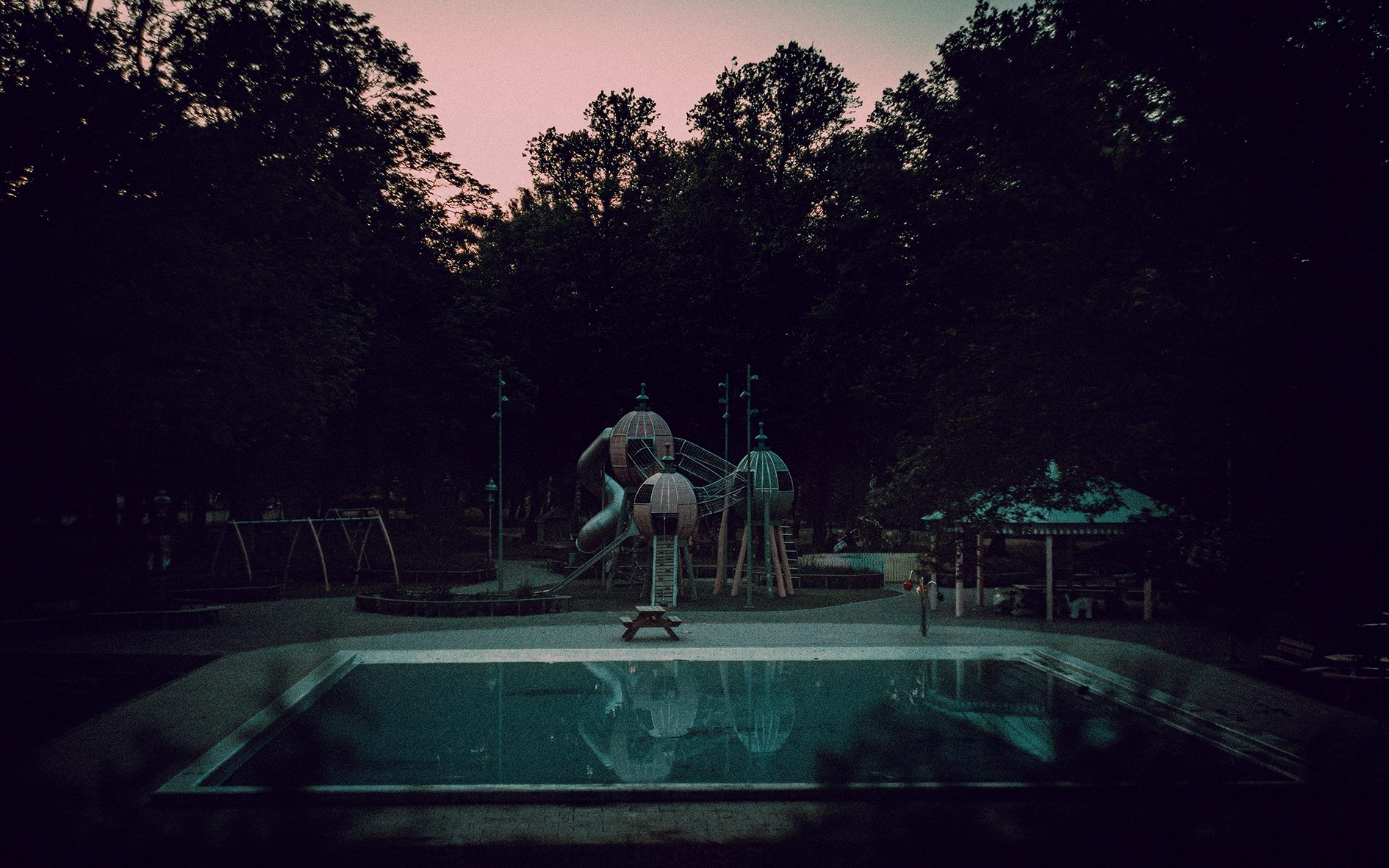 Public pool empty by blue hour