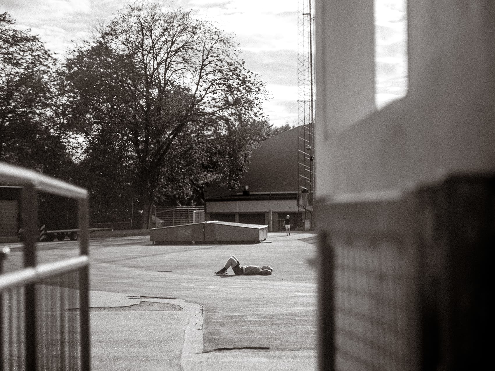 Tired runner resting on the ground