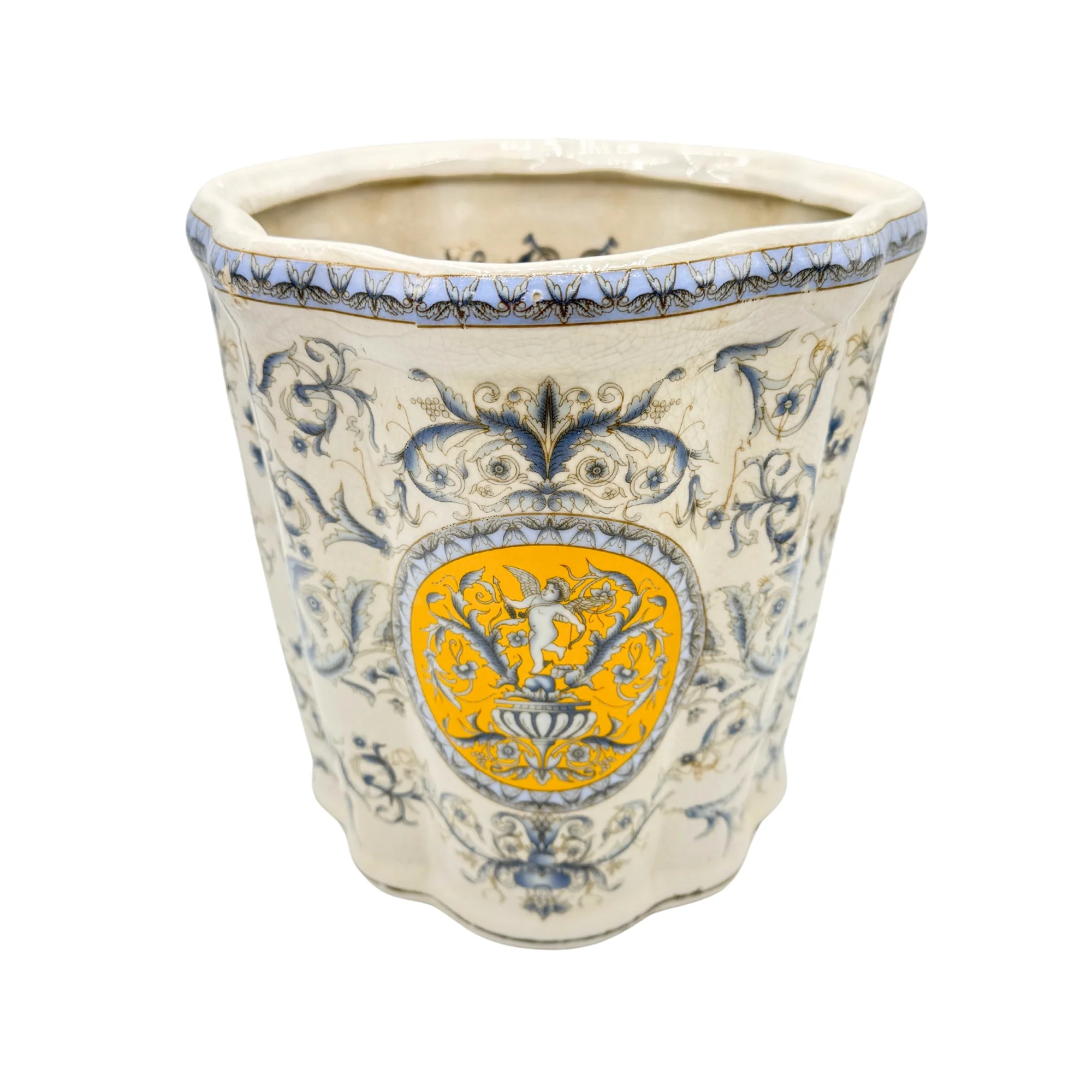 Petite vasque en céramique blanche décorée de motifs floraux bleus et d'un ange sur fond jaune.