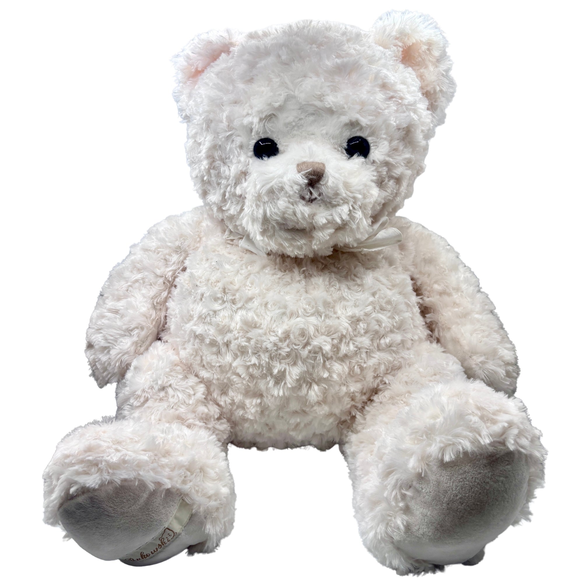 Grande peluche ours crème au pelage bouclé, yeux noirs brillants, nez marron et ruban au cou