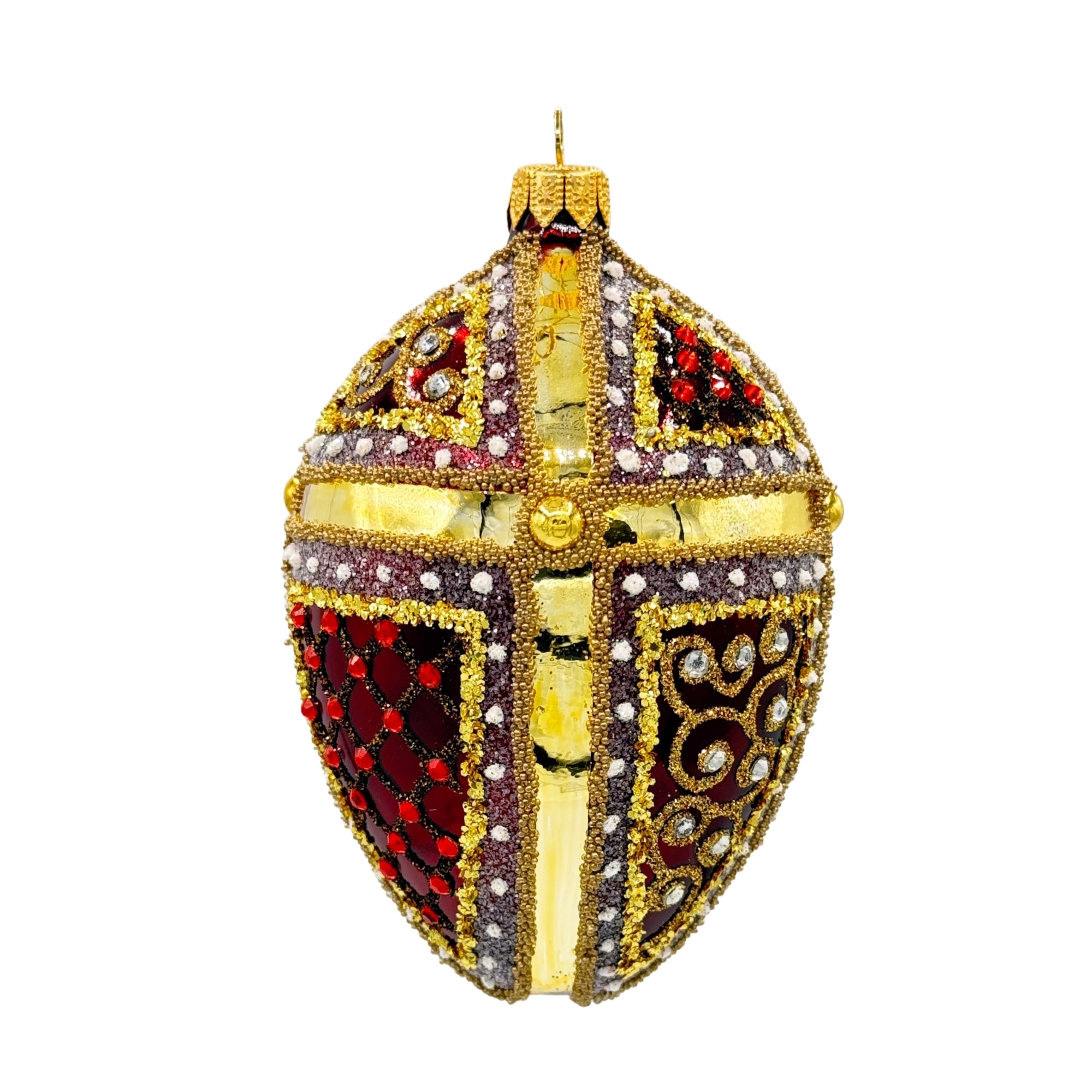 Œuf de Noël en verre décoratif avec panneaux rouges, croix dorée en relief et ornements strassés, suspension métallique