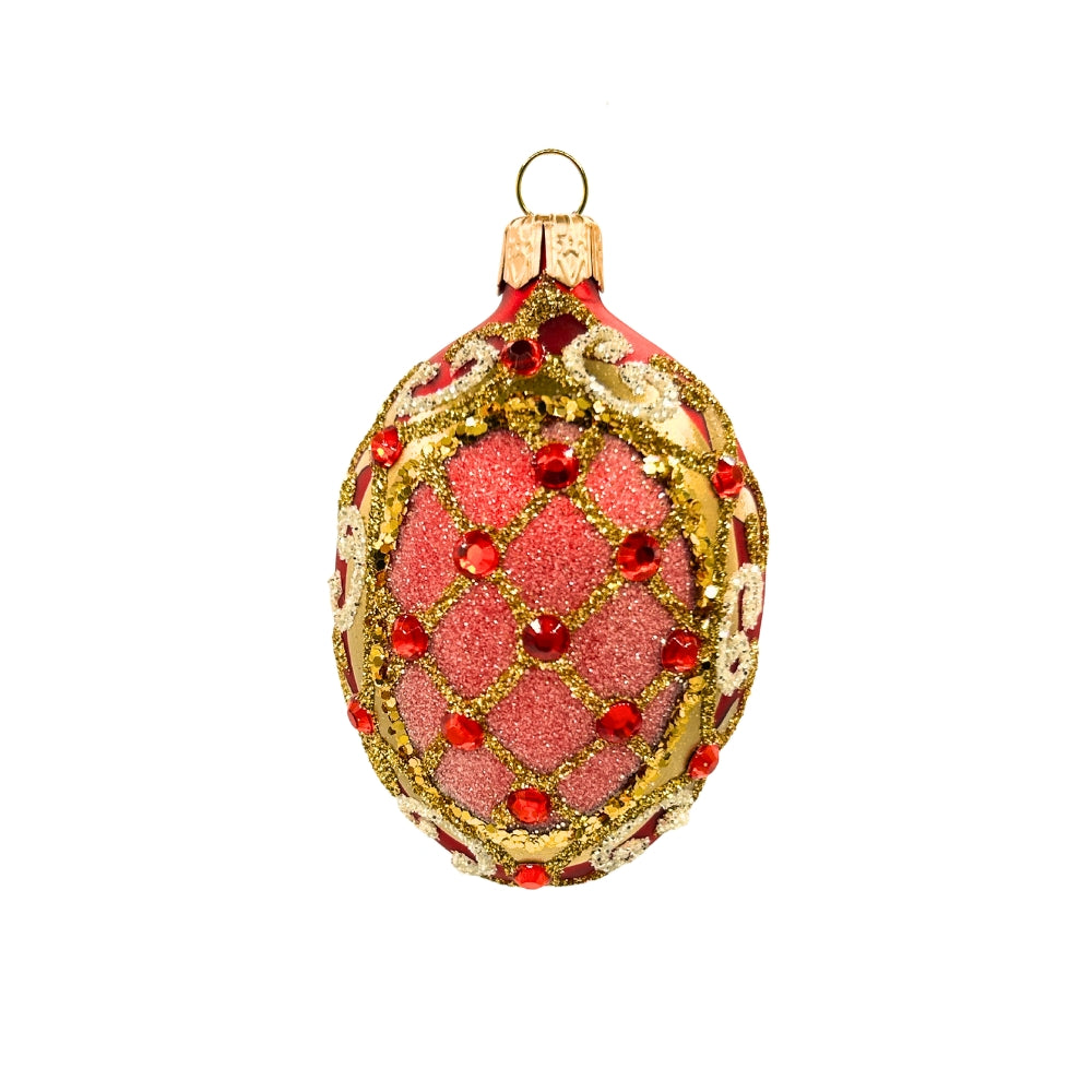 Oeuf de Noël en verre rouge pailleté, décor doré en treillis et cabochons rouges