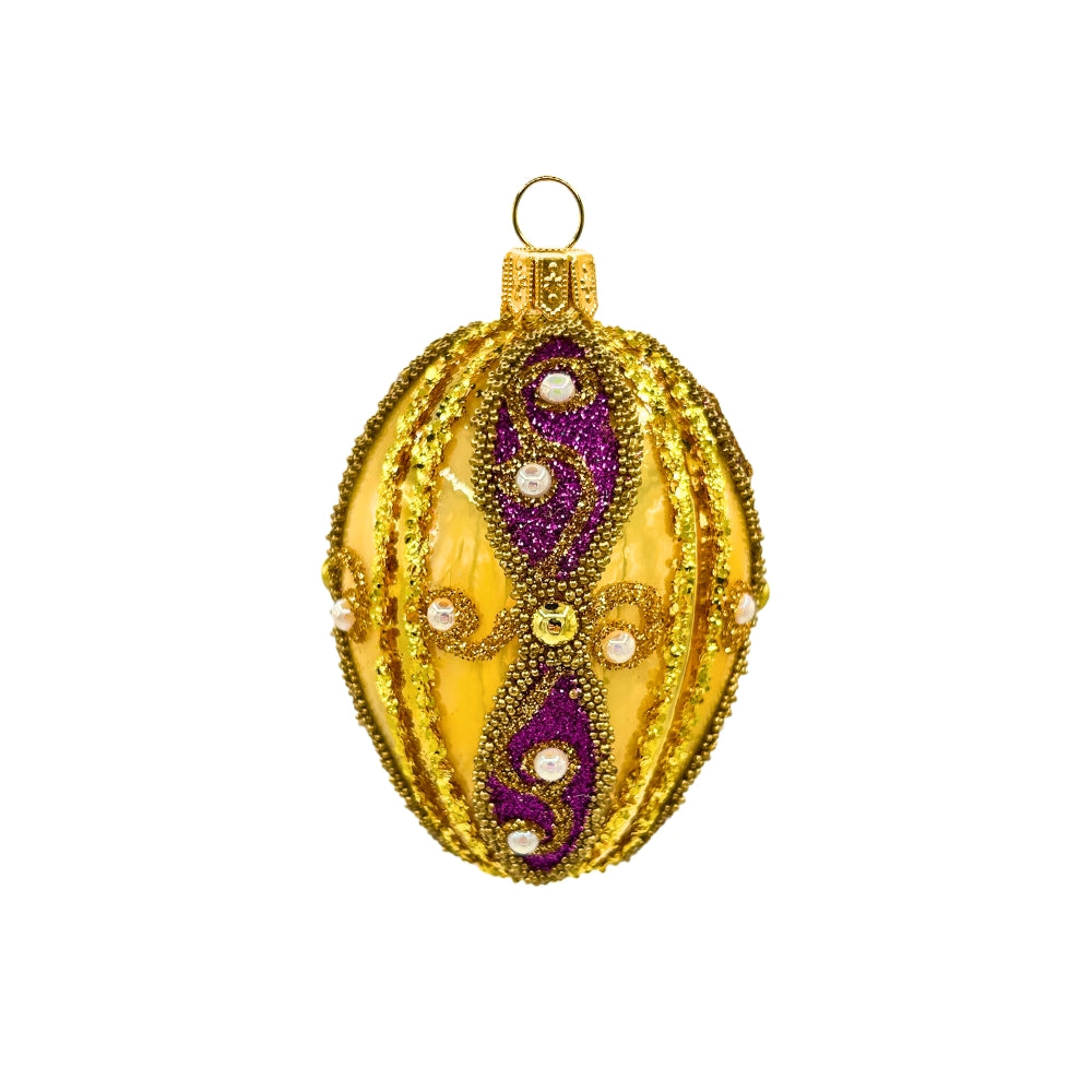 Oeuf de Noël en verre soufflé doré avec motifs violets, paillettes et perles blanches