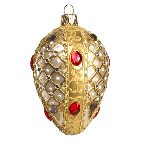 Œuf en verre soufflé doré, orné de strass et cabochons rouges